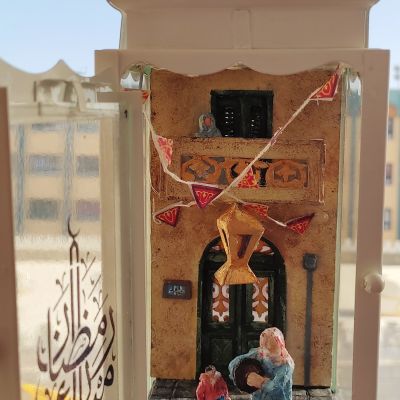 Ramadan lantern containing a scene from an Egyptian street during Ramadan