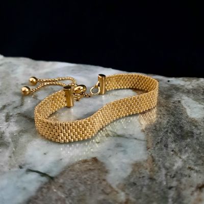 A gold-colored bracelet by Miyuki beads