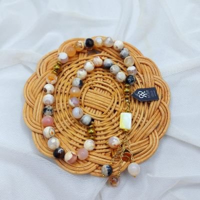 A 33-bead rosary made of agate stones, hematite spacers, and Chinese gold-plated chains.