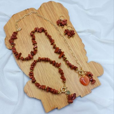 A set including a necklace, earrings, and a bracelet, made from broken agate stones