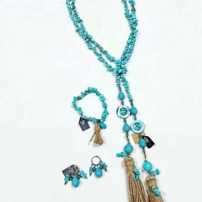 A set of a scarf necklace, earrings, and bracelet made from turquoise stones.