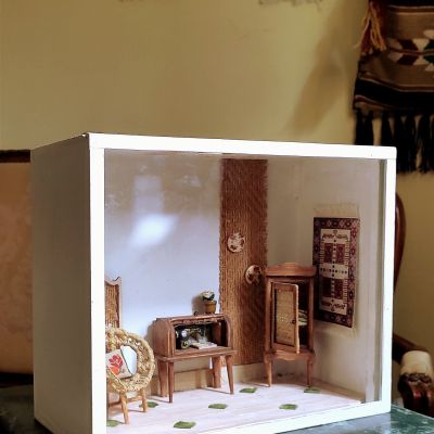  Decoration of a small room containing furniture and a sewing machine entirely handcrafted