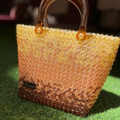 A beach bag made of crystal beads 