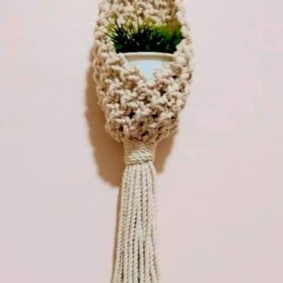 A macrame plant holder 