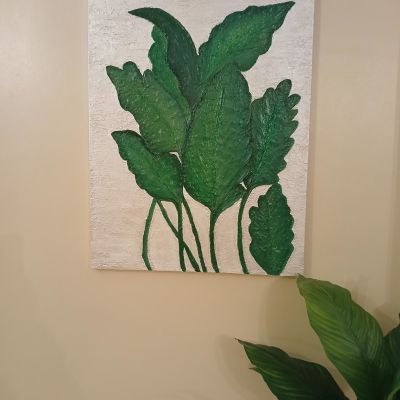 Handmade canvas with  shiny leaves 