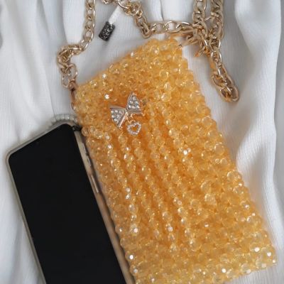 Mobile case with golden crystal beads