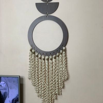 Wooden hanging with macrame ropes