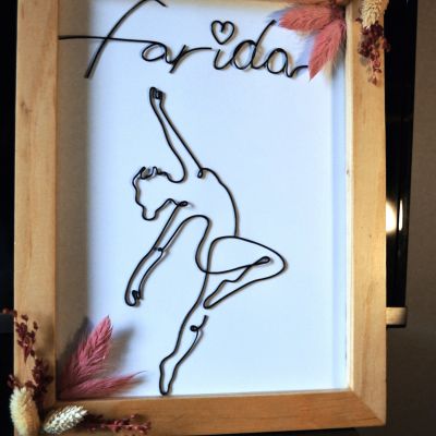 Wooden frame with art of wire 