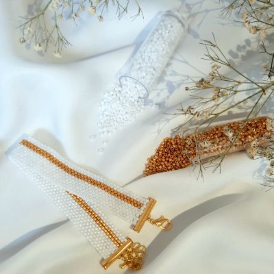 A simple white bracelet with golden script by Miyuki beads