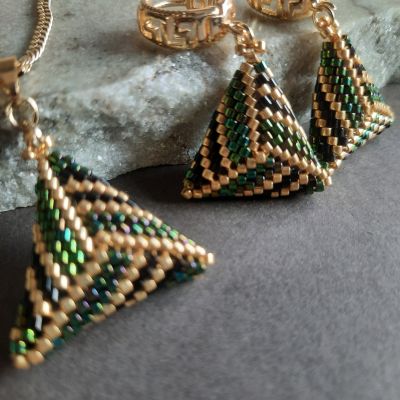 A set of wavy green symmetrical triangle shaped by Miyuki beads