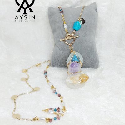 A necklace made of quartz and turquoise stones"