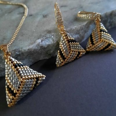 A set of symmetrical triangle-shaped, silver-colored by Miyuki beads