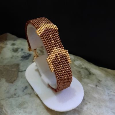 A dark red belt-style bracelet by Miyuki beads