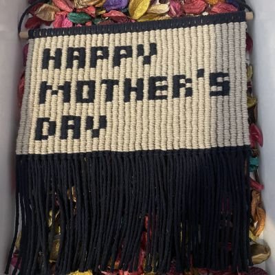 A “Happy Mother’s Day” macrame wall hanging