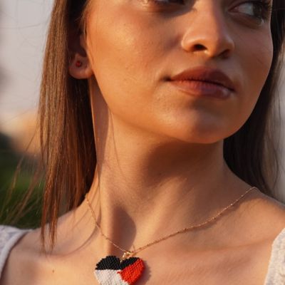 A heart-shaped necklace of the colors of the Palestinian flag by Miyuki beads