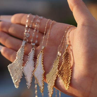 A necklace of the Palestine map in different shiny colors of Miyuki beads