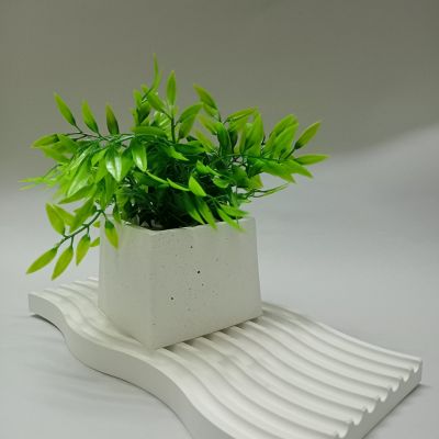 A modern planter that helps add an aesthetic appearance to your home