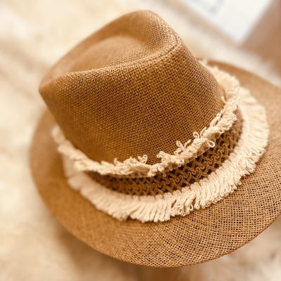 A summer hat decorated with threads