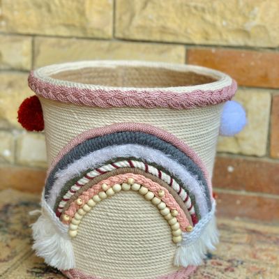 Basket with macrame threads