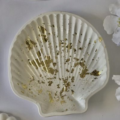 A decorative piece in the shape of a seashell 