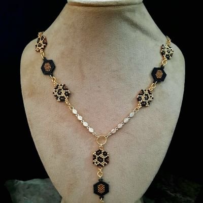 A golden tiger skin design necklace by Miyuki beads