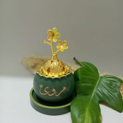 Royal incense burner in distinctive olive color with a round coaster with the name