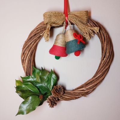 Round wooden hanging with bell